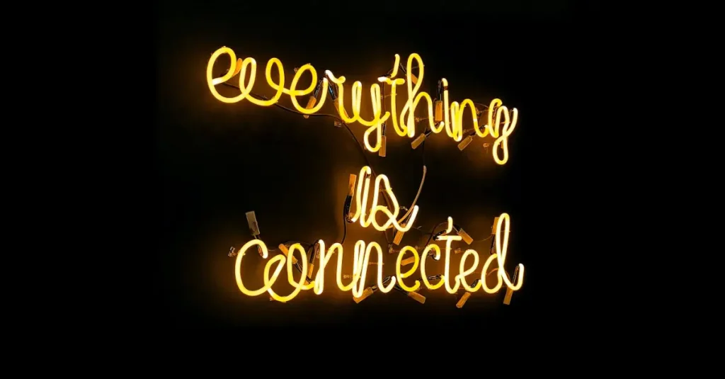 A neon sign written, in friendly cursive script, reads “everything is connected”.